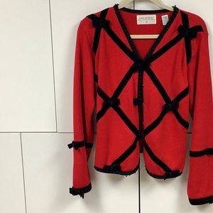 Women’s Size S red cardigan with black velvet detail.